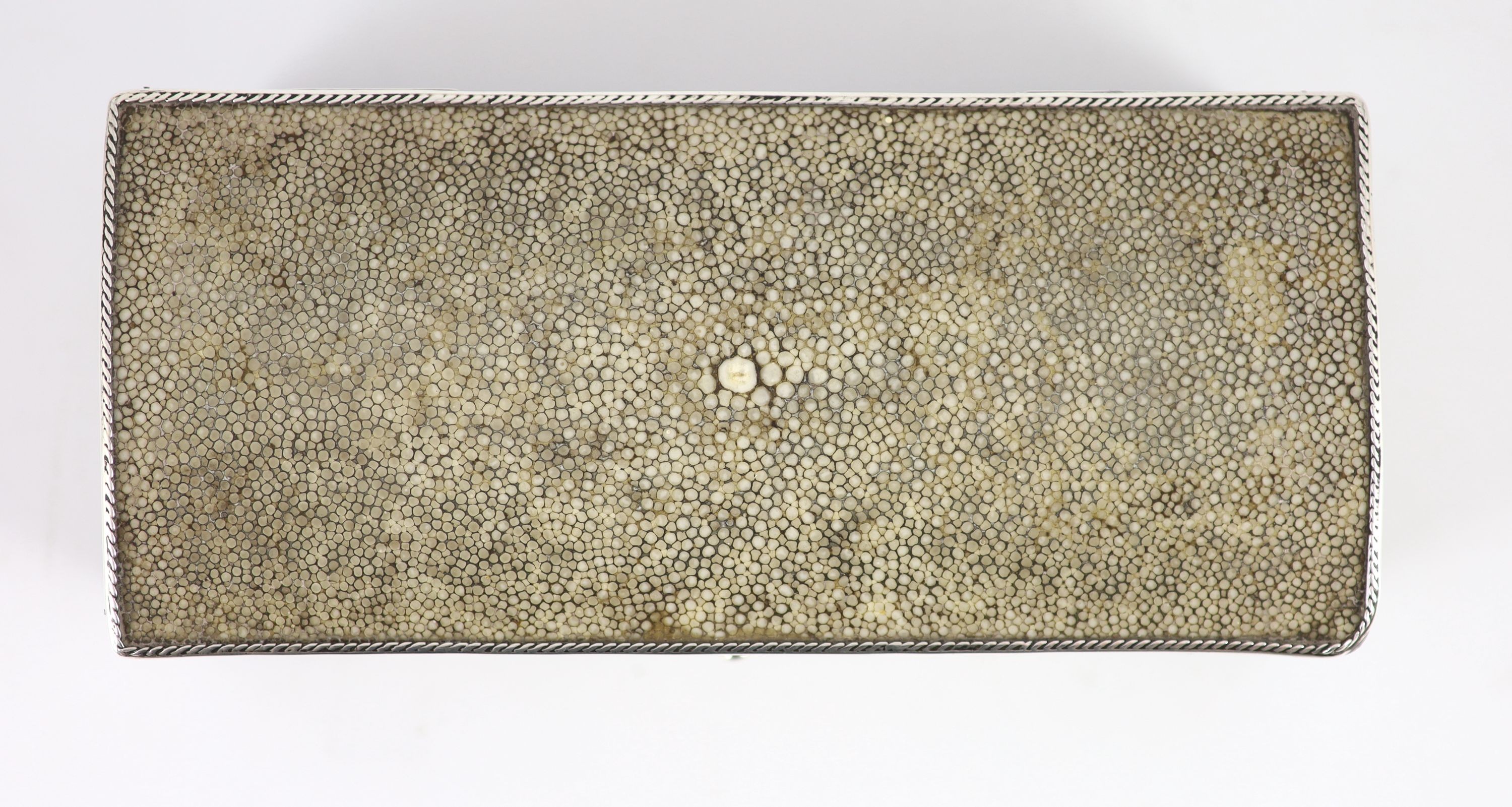 An Arts and Crafts silver mounted shagreen rectangular cigarette box, by John Paul Cooper